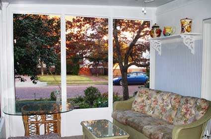 Outside view of a Screen Only Sunroom manufactured by The Sunroom Source